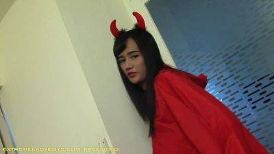 Brunette ladyboy with devil's horns rides a fat cock on the sofa - hotmovs.com